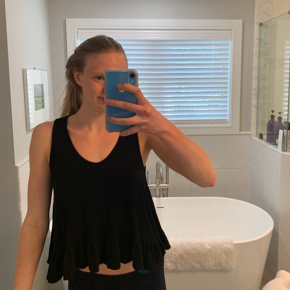 Black shirt with ruffles on bottom